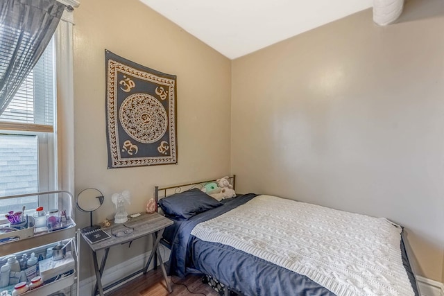 4026 N Kimball Ave, Chicago, IL 60618 - bedroom featuring multiple windows and wood finished floors
