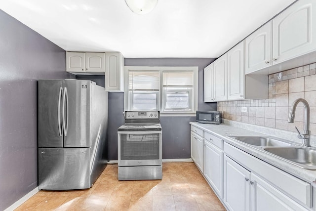 4026 N Kimball Ave, Chicago, IL 60618 - kitchen featuring light tile patterned floors, baseboards, a sink, appliances with stainless steel finishes, and decorative backsplash