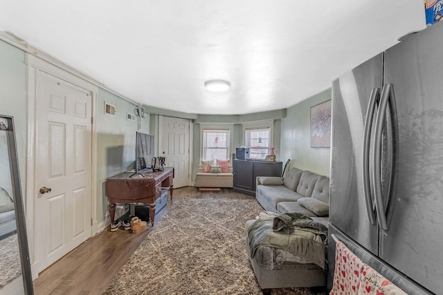 4026 N Kimball Ave, Chicago, IL 60618 - bedroom featuring freestanding refrigerator and wood finished floors