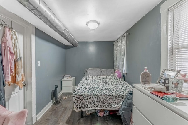 4026 N Kimball Ave, Chicago, IL 60618 - bedroom with baseboards and wood finished floors