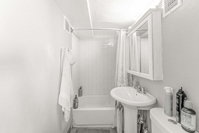 4026 N Kimball Ave, Chicago, IL 60618 - bathroom featuring toilet, shower / bathtub combination with curtain, a sink, and visible vents