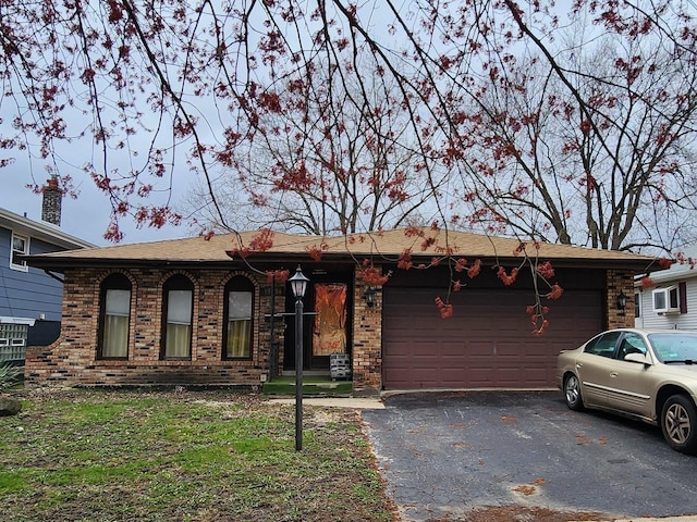 18454 Ridgewood Ave, Lansing, IL 60438 - ranch-style house featuring brick siding, a garage, and driveway