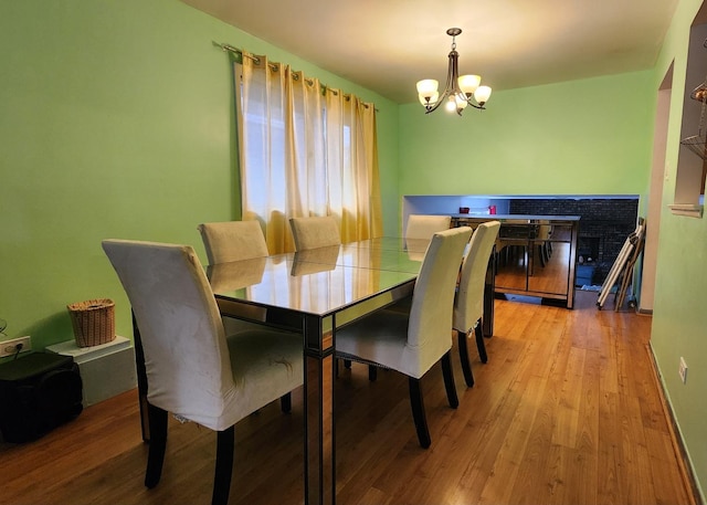 18454 Ridgewood Ave, Lansing, IL 60438 - dining space featuring a chandelier and wood finished floors