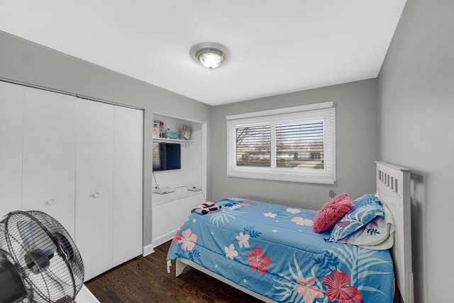 bedroom featuring a closet and wood finished floors