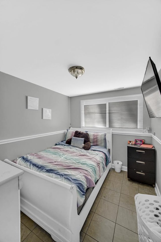 bedroom featuring light tile patterned floors