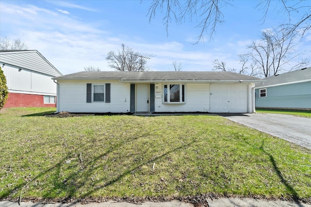 ranch-style house featuring an attached garage, driveway, and a front yard