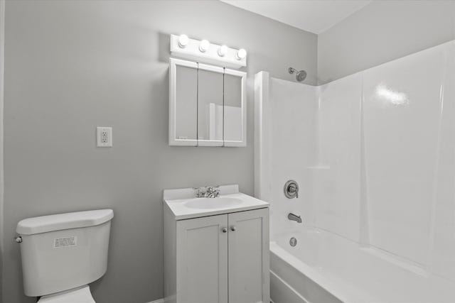 bathroom featuring toilet, shower / tub combination, and vanity
