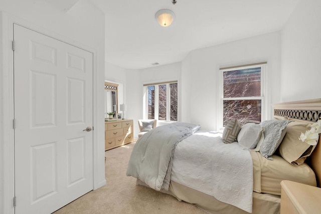 bedroom with light carpet