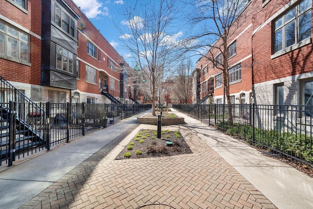 surrounding community featuring fence and a residential view