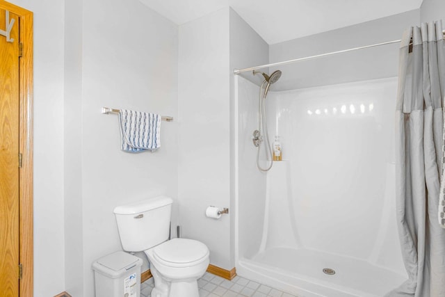 8411 Kirby Dr, Tinley Park, IL 60487 - bathroom featuring toilet, a stall shower, baseboards, and tile patterned floors