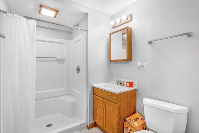 8411 Kirby Dr, Tinley Park, IL 60487 - bathroom featuring toilet, vanity, a stall shower, and tile patterned flooring