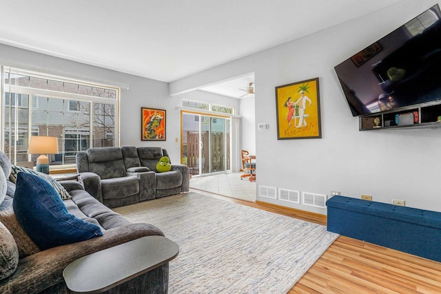 8411 Kirby Dr, Tinley Park, IL 60487 - living room with visible vents, ceiling fan, wood finished floors, and baseboards