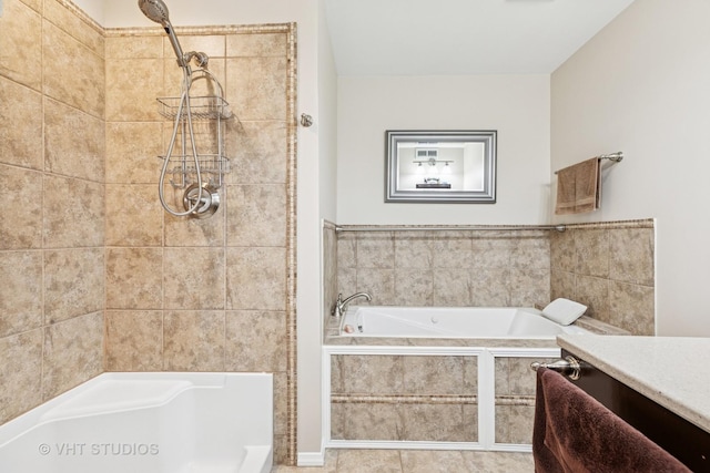 full bath featuring a relaxing tiled tub and walk in shower