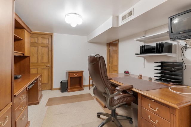 office space with visible vents and baseboards