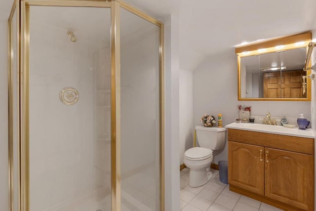 bathroom featuring a shower stall, tile patterned flooring, vanity, and toilet