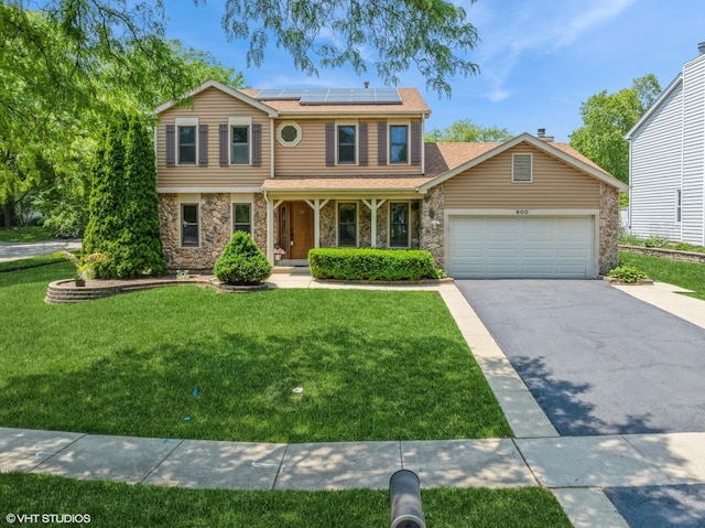 600 N Brookdale Dr, Schaumburg, IL 60194 - traditional-style home with stone siding, a porch, driveway, and roof mounted solar panels