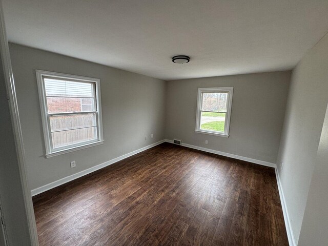 full bath with toilet, baseboards, marble finish floor, and vanity