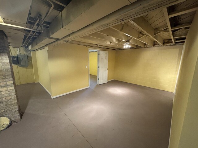interior space featuring baseboards and wood finished floors