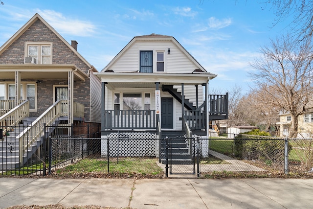 view of front of property featuring a chimney, a fenced front yard, stairs, a gate, and covered porch