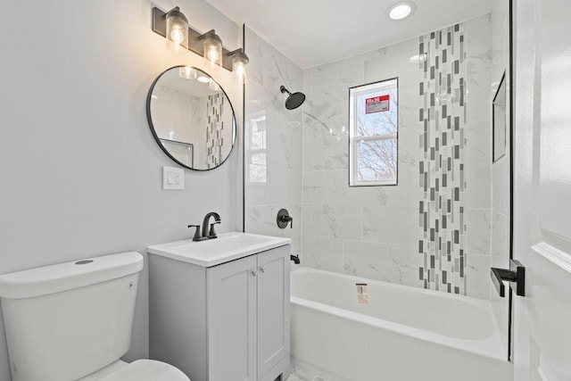 full bath featuring toilet, bathtub / shower combination, and vanity