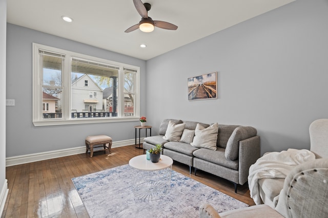 living room with wood-type flooring, baseboards, recessed lighting, and ceiling fan