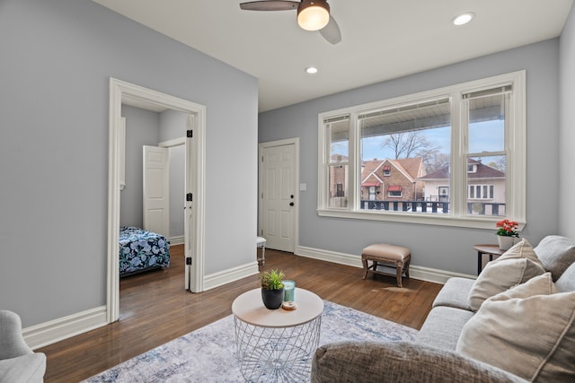 living area featuring baseboards, recessed lighting, ceiling fan, and wood finished floors