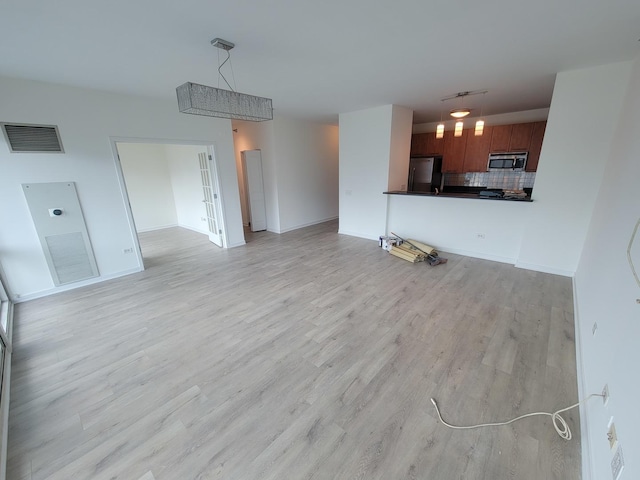 757 N Orleans St Unit 1004, Chicago, IL 60654 - unfurnished living room featuring light wood-style flooring, baseboards, and french doors