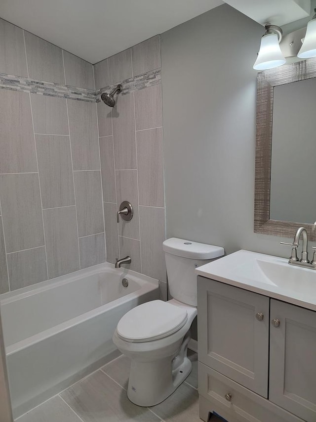full bath featuring washtub / shower combination, vanity, toilet, and tile patterned flooring
