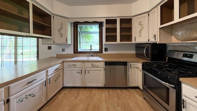 6092 Torch Lite Trl, Loves Park, IL 61111 - kitchen featuring open shelves, appliances with stainless steel finishes, light countertops, and light wood-style flooring