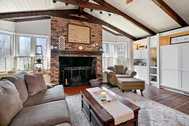 living room featuring wood ceiling, vaulted ceiling with beams, wood finished floors, and a fireplace