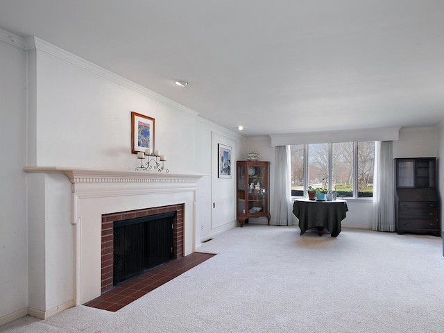 living area featuring a fireplace, baseboards, carpet floors, and crown molding