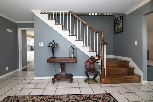 stairway with tile patterned floors, baseboards, and crown molding
