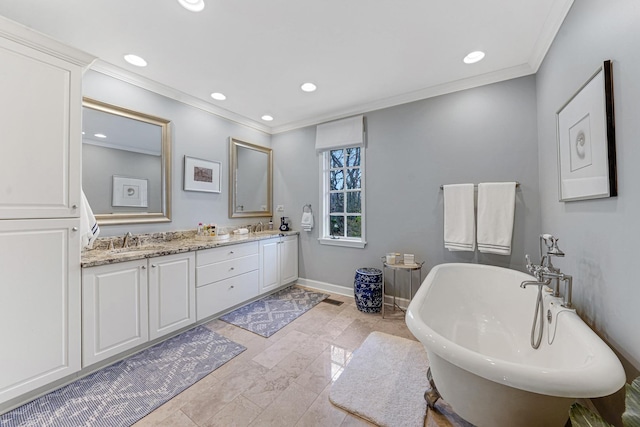bathroom with crown molding, recessed lighting, and a freestanding bath