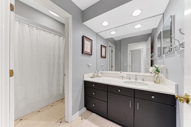 full bath featuring vanity, baseboards, a shower with shower curtain, recessed lighting, and tile patterned floors
