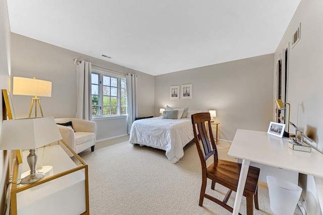 bedroom featuring visible vents, carpet, and baseboards