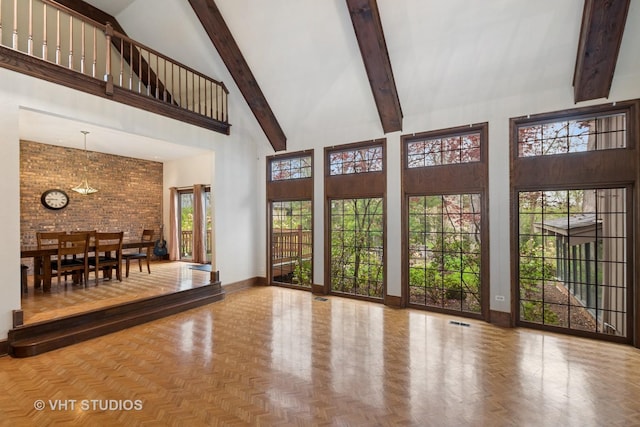 living area featuring high vaulted ceiling, baseboards, beam ceiling, and visible vents