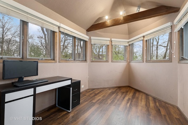 unfurnished office featuring a textured wall, vaulted ceiling, dark wood-style floors, and baseboards