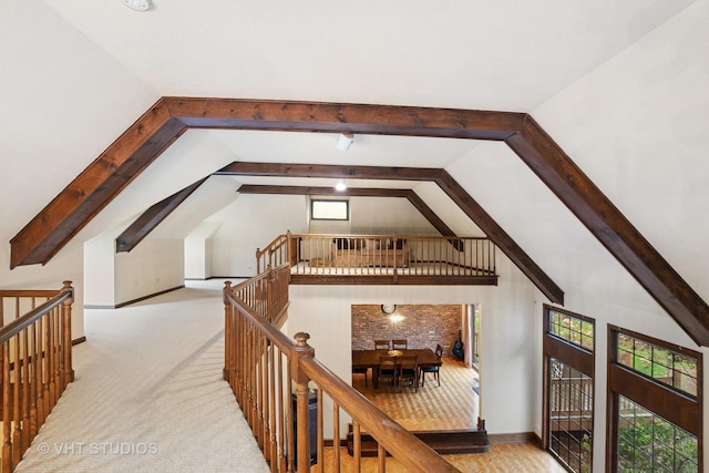 bonus room featuring vaulted ceiling with beams and carpet