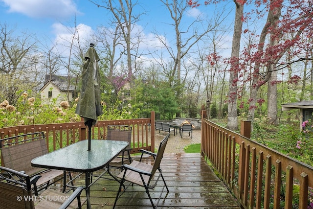 wooden deck with outdoor dining area