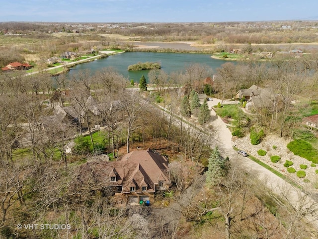 birds eye view of property featuring a water view