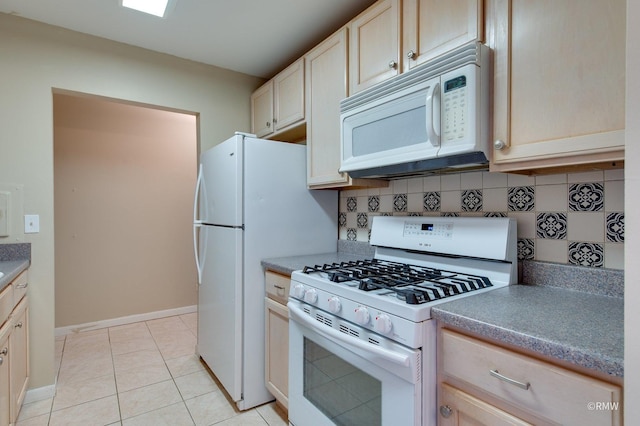 kitchen featuring white appliances, baseboards, light tile patterned floors, and decorative backsplash
