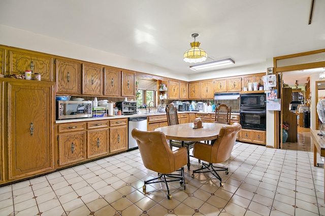 8850 W 101st Pl, Palos Hills, IL 60465 - kitchen featuring light countertops, brown cabinetry, and black appliances