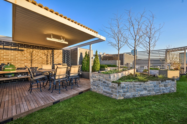 view of yard with outdoor dining space and a wooden deck