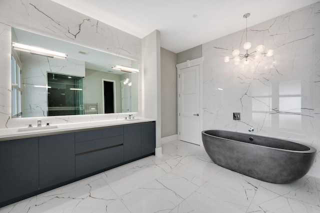 full bathroom with double vanity, a notable chandelier, a sink, and stone wall