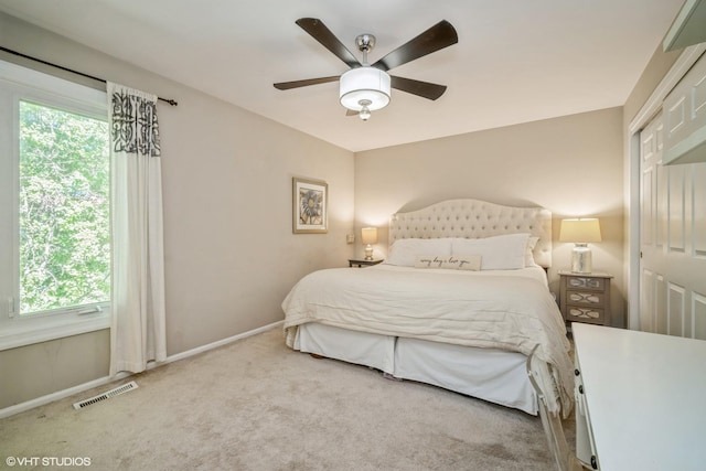 1767 Jefferson Ave, Glenview, IL 60025 - bedroom with visible vents, baseboards, ceiling fan, and carpet