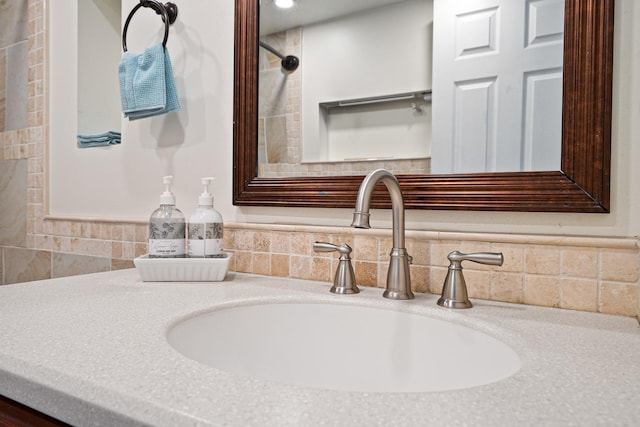 details featuring backsplash and vanity