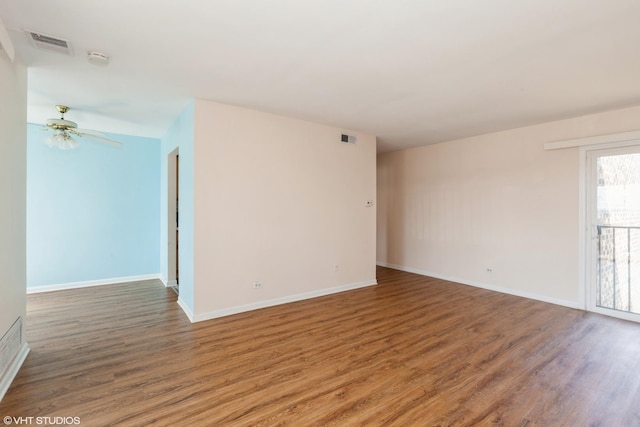 2287 Country Club Dr Unit 21A, Woodridge, IL 60517 - empty room with visible vents, baseboards, a ceiling fan, and wood finished floors