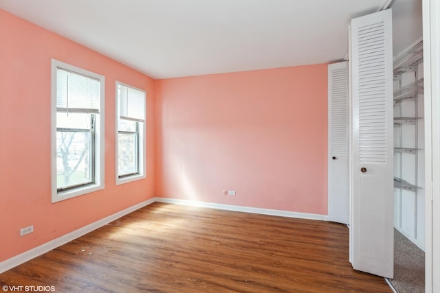 2287 Country Club Dr Unit 21A, Woodridge, IL 60517 - unfurnished bedroom with wood finished floors, baseboards, and a closet