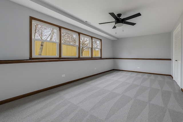 1097 Washington St, Bartlett, IL 60103 - empty room featuring baseboards, light colored carpet, and ceiling fan