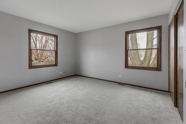 1097 Washington St, Bartlett, IL 60103 - carpeted empty room featuring baseboards